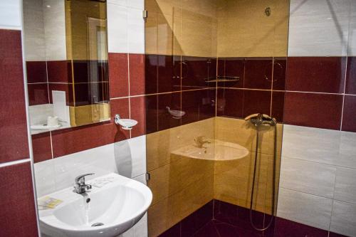Koupelna v ubytování Hotel Neva
