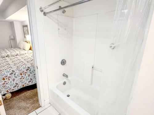 a bathroom with a shower and a bath tub at Verandas 602 in North Myrtle Beach