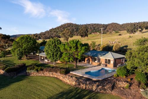 an aerial view of a house with a swimming pool at Allambie - Poolside Elegance in Mudgee Countryside in Mudgee