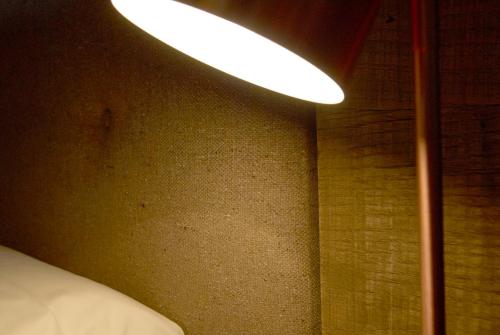 a light that is hanging from a wall at Hotel Boutique Puig Francó - Adults Only in Camprodon