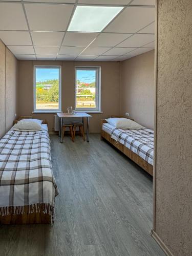 Ένα ή περισσότερα κρεβάτια σε δωμάτιο στο Хостел Ринковий