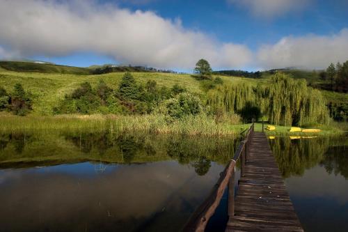 a wooden bridge over a body of water at 20 Mount Champagne in Champagne Valley