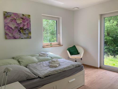 Postel nebo postele na pokoji v ubytování Ferienapartment An der Milseburg