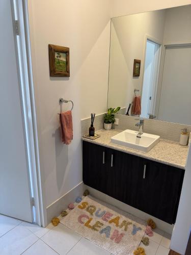 a bathroom with a sink and a mirror at Toodyay Upon Avon Guest House and Gallery in Toodyay
