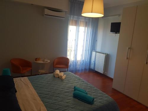 a bedroom with a bed with two stuffed animals on it at Nonna Lucia in San Giorgio Ionico
