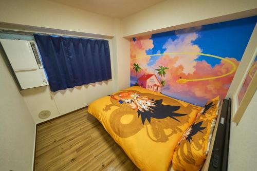 a bedroom with a bed with a painting on the wall at Kan'eiji-zaka Heim 寛永寺坂ハイム in Tokyo