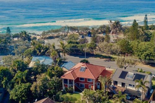 an aerial view of a house and the ocean at Big family holiday by the Buddina beach in Buddina