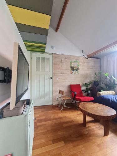 a living room with a couch and a table at the home of the gnome in Eindhoven