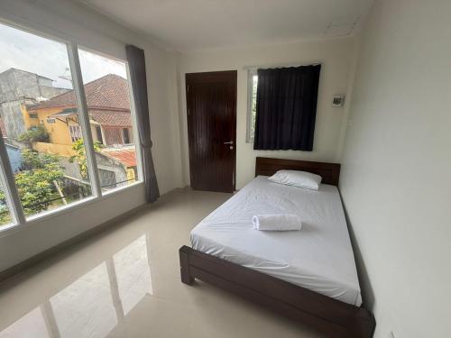 Postel nebo postele na pokoji v ubytování Balai Nyaman