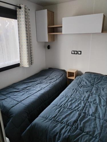 Llit o llits en una habitació de Le SPLENDIDE