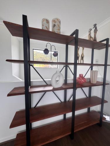 a wooden shelf with some items on it at The Great Apollo Bay Retreat in Apollo Bay