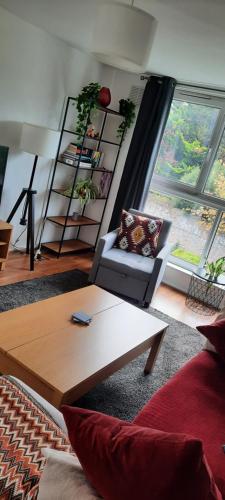 a living room with a couch and a coffee table at Palace flat in London