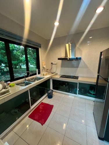 a kitchen with a sink and a counter top at GL Homestay in Sibu