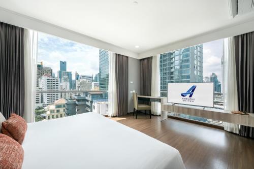 Katil atau katil-katil dalam bilik di Adelphi Suites Bangkok