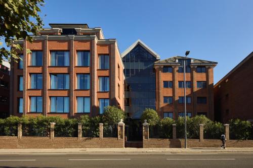 a building on the side of a city street at The Hill by Nestor in Harrow