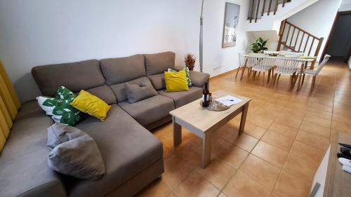 a living room with a couch and a table at Villa Tingafa in Yaiza