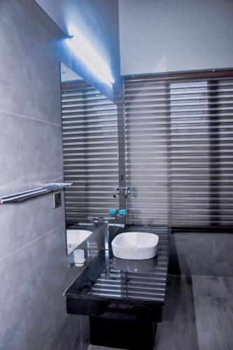 a bathroom with a sink and a toilet at Elite Black Villa in Bandaragama