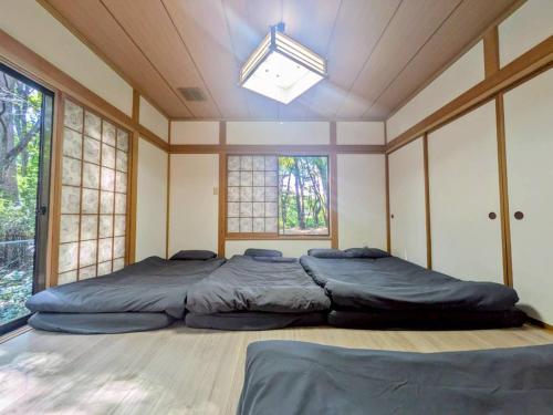 Ένα ή περισσότερα κρεβάτια σε δωμάτιο στο Nasu Central Private Villa