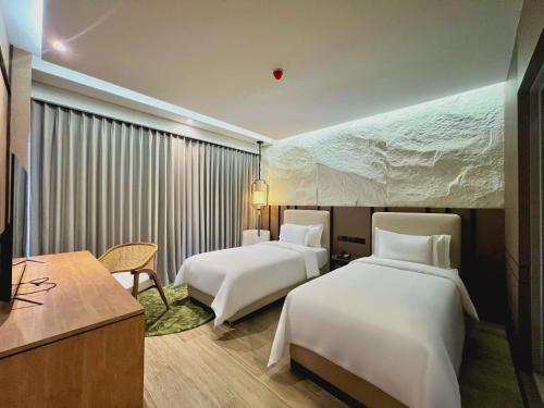 Ένα ή περισσότερα κρεβάτια σε δωμάτιο στο Myze Hotel Waingapu