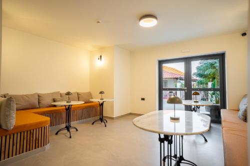 a living room with a couch and a table at Naiades Guest House in Sálakos