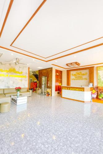 a large lobby with a large room with a white floor at HQ Hotel & Apartment in Hai Phong