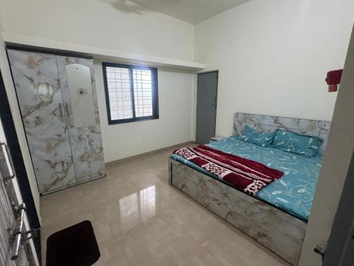 a bedroom with a bed and a shower in it at 2BHK Nature Stay in Wādhiware