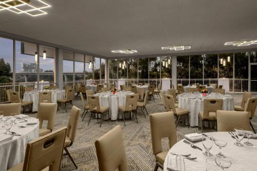 a banquet hall with tables and chairs with white tablecloths at Sheraton La Jolla in San Diego