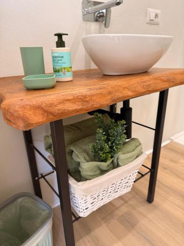 a bathroom counter with a sink and a bowl at Ca' dei lecci in Tuoro sul Trasimeno
