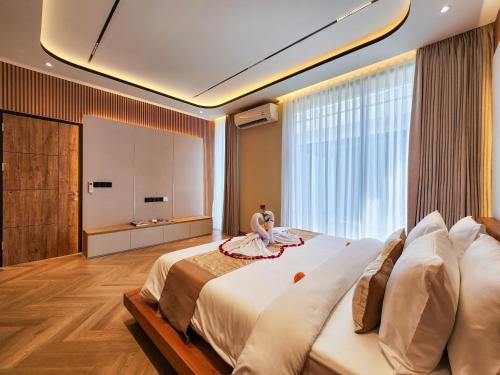 Ένα ή περισσότερα κρεβάτια σε δωμάτιο στο Casa Verano Jimbaran by Nagisa Bali