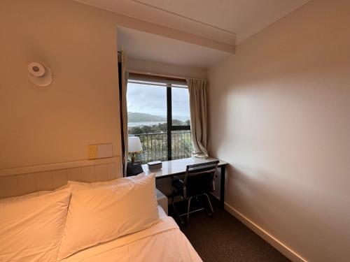 Ένα ή περισσότερα κρεβάτια σε δωμάτιο στο Harbour View Apartment