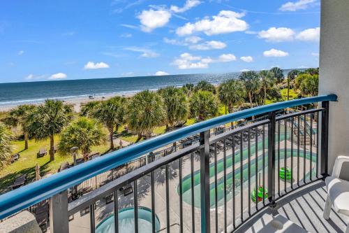 a balcony with a view of the beach and the ocean at Boardwalk Resort 233 in Myrtle Beach