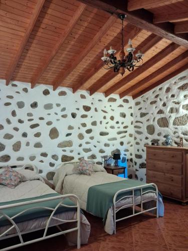 En eller flere senge i et værelse på Casa Chopino