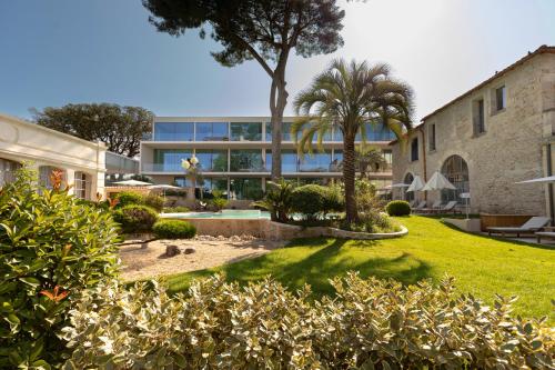 a view of a building with a yard at Domaine de Verchant & Spa - Relais & Châteaux in Montpellier