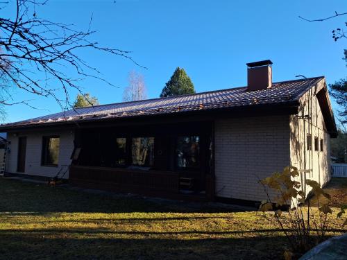 an old house with a window and a roof at NorthSlope in Rovaniemi