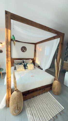 En eller flere senge i et værelse på Le Second Paradis