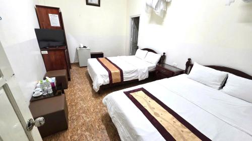 Postel nebo postele na pokoji v ubytování Hotel Duy Dang