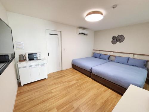 Kuchyň nebo kuchyňský kout v ubytování 櫻時雨-新大阪民泊