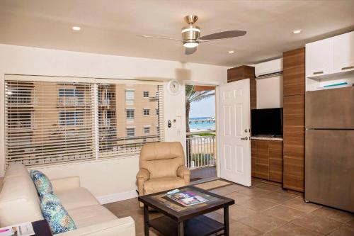 a living room with a couch and a table at Windjammer Resort and Beach Club in Fort Lauderdale