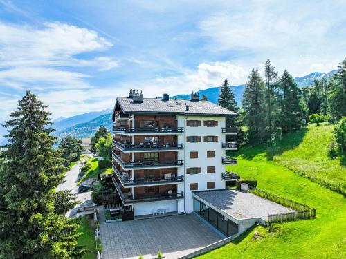 an aerial view of a building in the mountains at Apartment Bietschorn 33 by Interhome in Nendaz