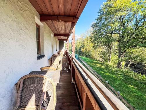 a porch with benches and a wooden roof at Apartment Cheeky Apartment-3 by Interhome in Oberndorf in Tirol