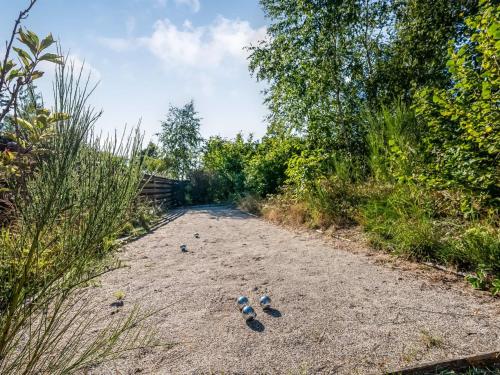 a group of shoes sitting on a dirt road at Holiday Home Tede - 1km from the sea by Interhome in Ebeltoft