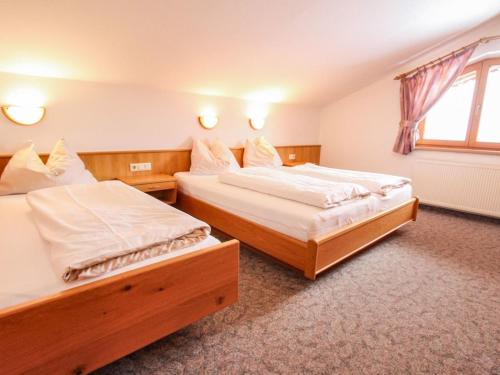 Ένα ή περισσότερα κρεβάτια σε δωμάτιο στο Apartment Voithofer-2 by Interhome