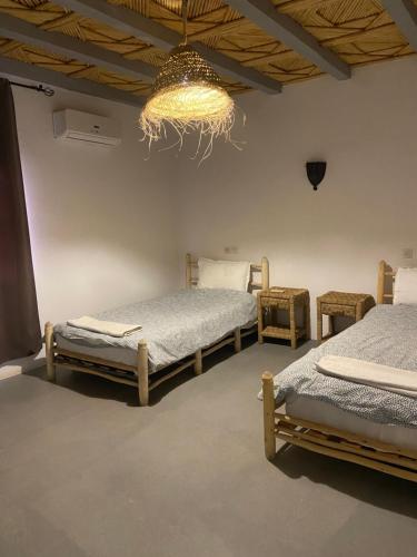 Postel nebo postele na pokoji v ubytování Etoile d Or Ksar Ait Ben Haddou