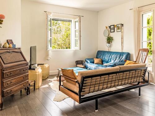 a living room with a couch and a table at Holiday Home OLHAKO BIDEA by Interhome in Amotz