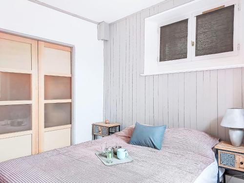 Giường trong phòng chung tại Apartment Au Bon Coin by Interhome