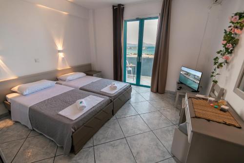 Postel nebo postele na pokoji v ubytování Angela & Thalia Apartments