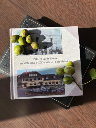 a magazine with a bunch of green grapes on it at Le Saint-Pierre in Mézidon-Canon