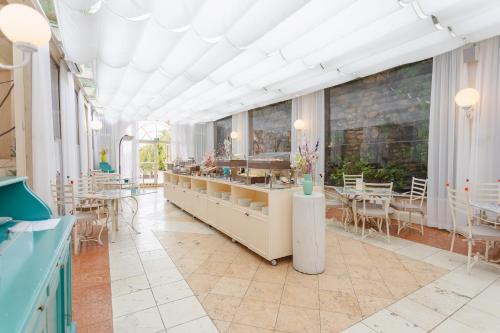 Posezení v ubytování Byblos Art Hotel Villa Amistà