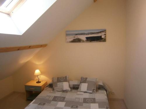 a bedroom with a bed in a attic at Gite Du Randonneur in Sennecey-le-Grand
