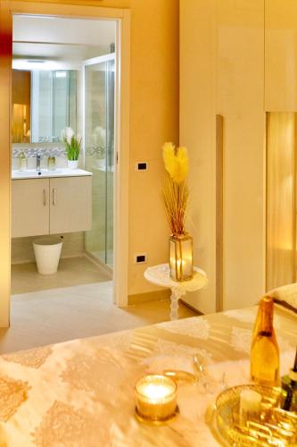 a bathroom with a bed and a sink in a room at Nuova Fiera di Roma in Ponte Galeria